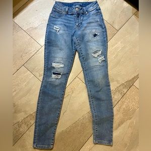 Distressed patched skinny jeans